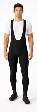 Person wearing a black cycling bib overalls with a white shirt, shown from front and back on a white background.