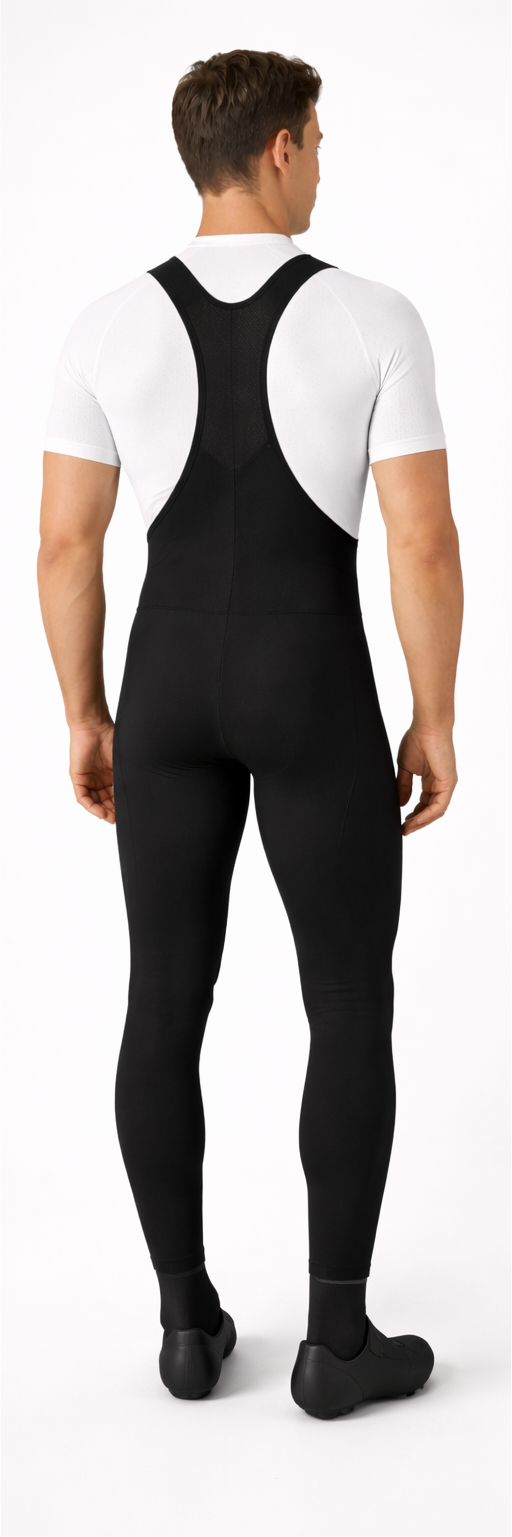 Person wearing a black cycling bib overalls with a white shirt, shown from front and back on a white background.