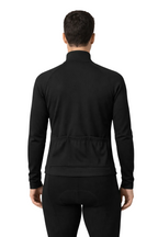 Person wearing a black long-sleeve athletic outfit on a white background