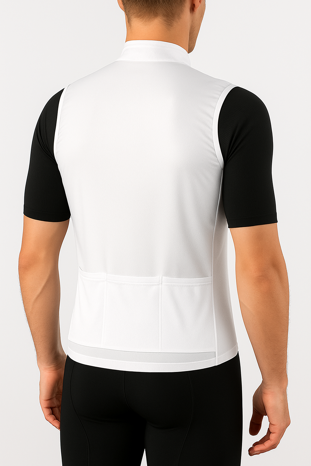 Person wearing a white cycling jersey with black sleeves on a plain background